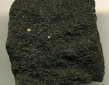 Figure 1. Bitumen soaked sandstone.[5]