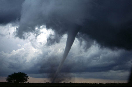 Figure 2: A tornado is a violently rotating column of air that can attain wind speeds of more than 480 km/h, stretch more than 3 km across, and stay on the ground for tens of kilometers.[4][5]