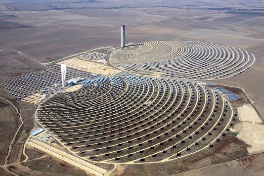 Figure 3. Two solar power towers at a solar thermal power plant.[5]