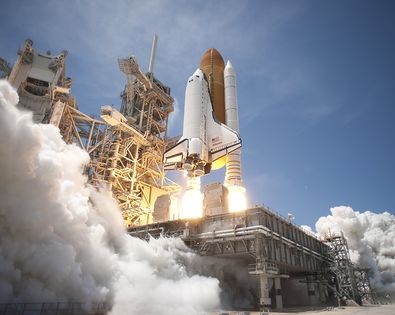 Figure 2. A rocket uses thrust to overcome the gravity of the Earth.[4]